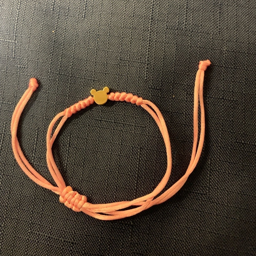 2/$13 pink string bracelet with gold tone Teddy bear head